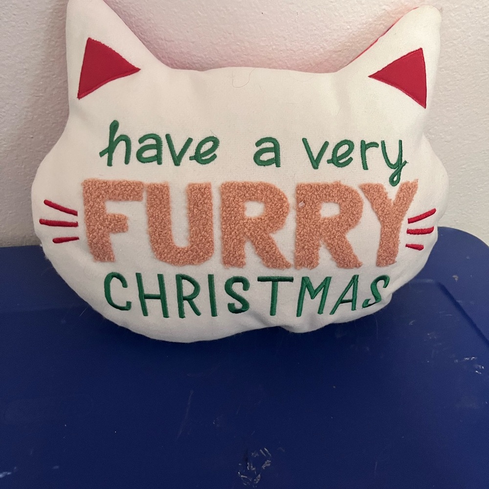 Wonder shop have a very furry Christmas cat pillow